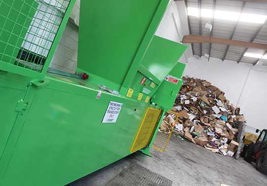 massive green cardboard compactor installed by phs wastekit enginerrs