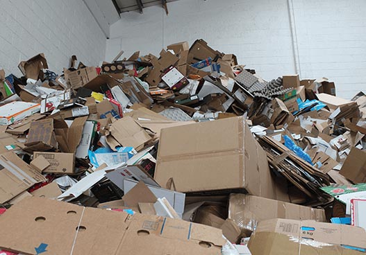 large pile of waste recyclable cardboard