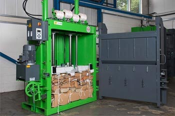 How does a waste recycling baler work?