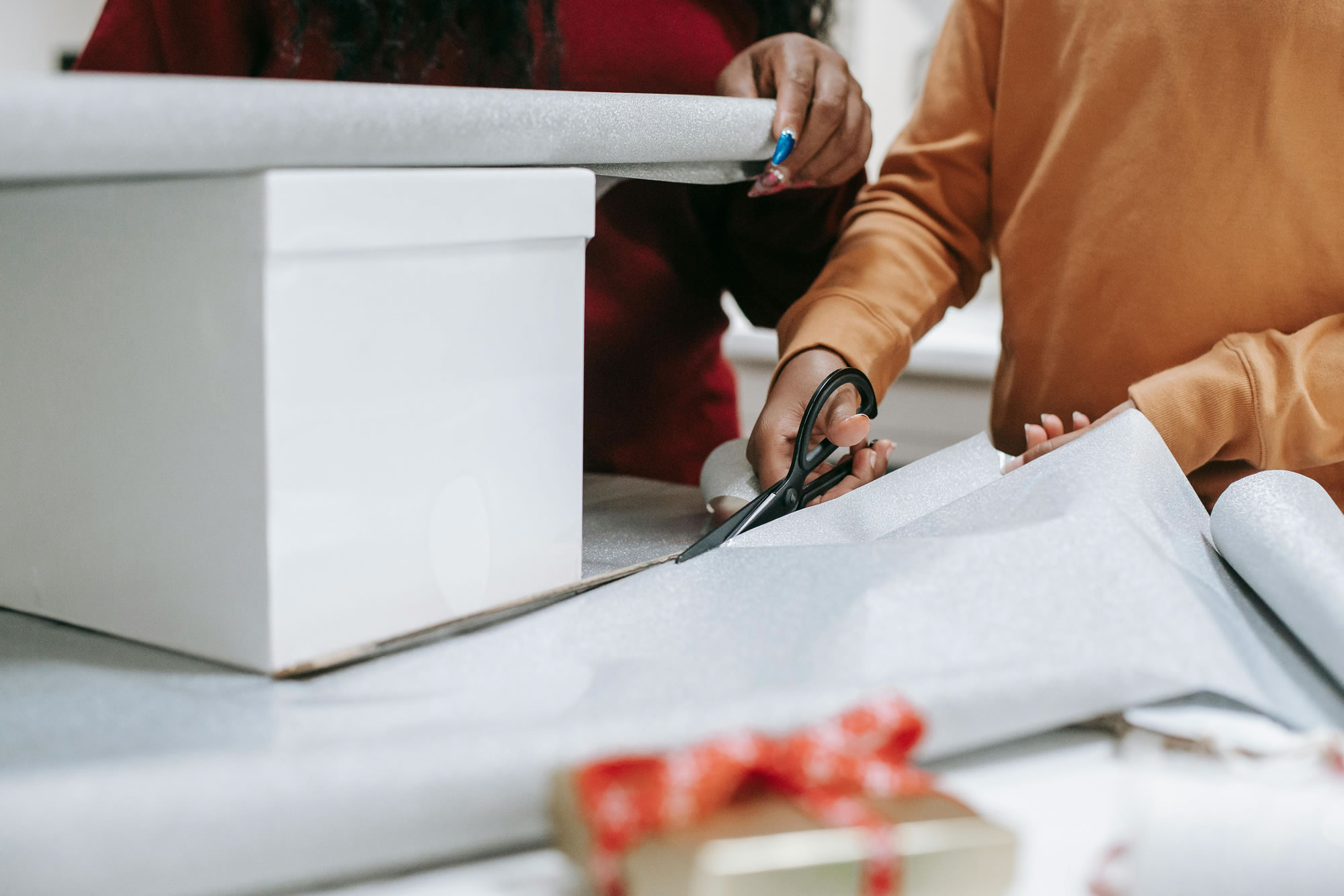 Christmas wrapping paper being cut