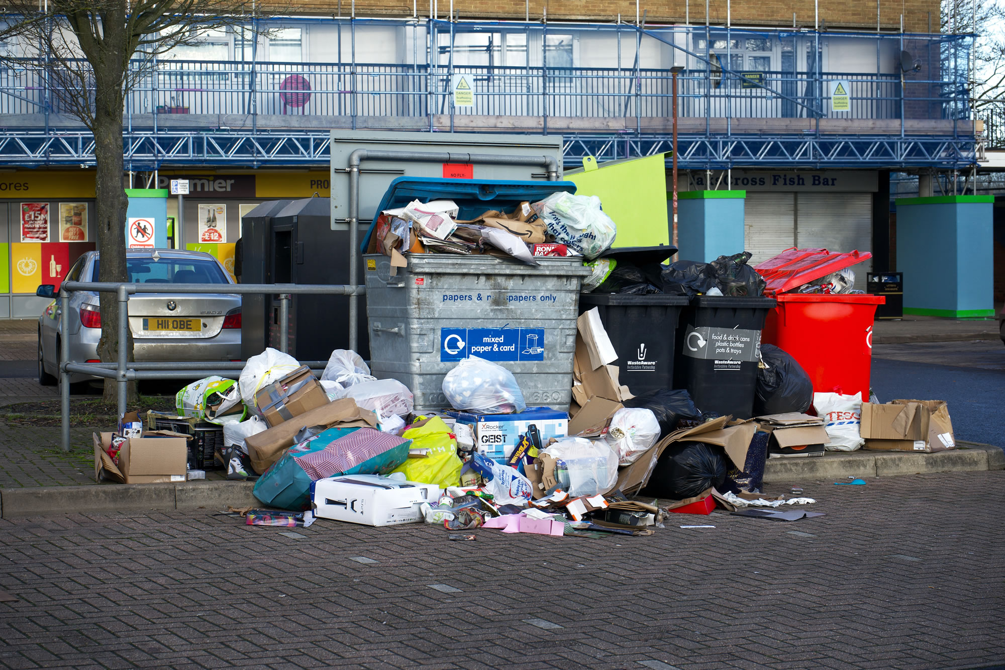 full recycling bins in street