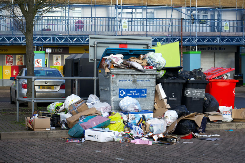 full recycling bins in street